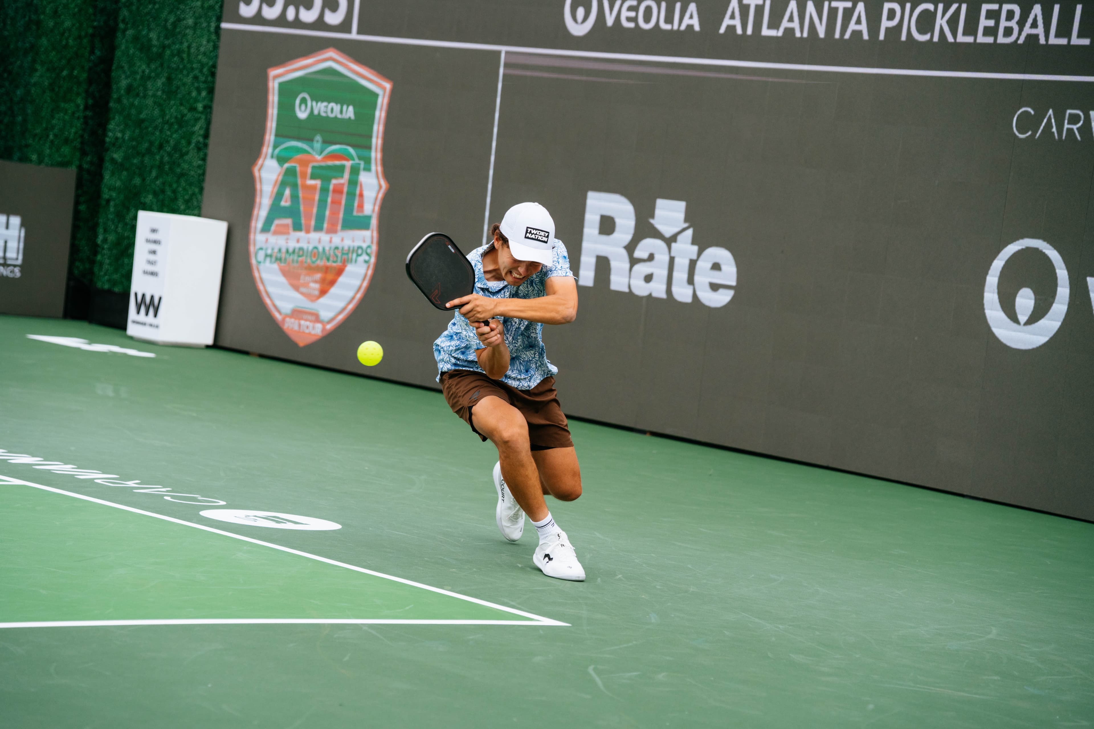 Connor Garnett driving through a low ball at the Atlanta Slam